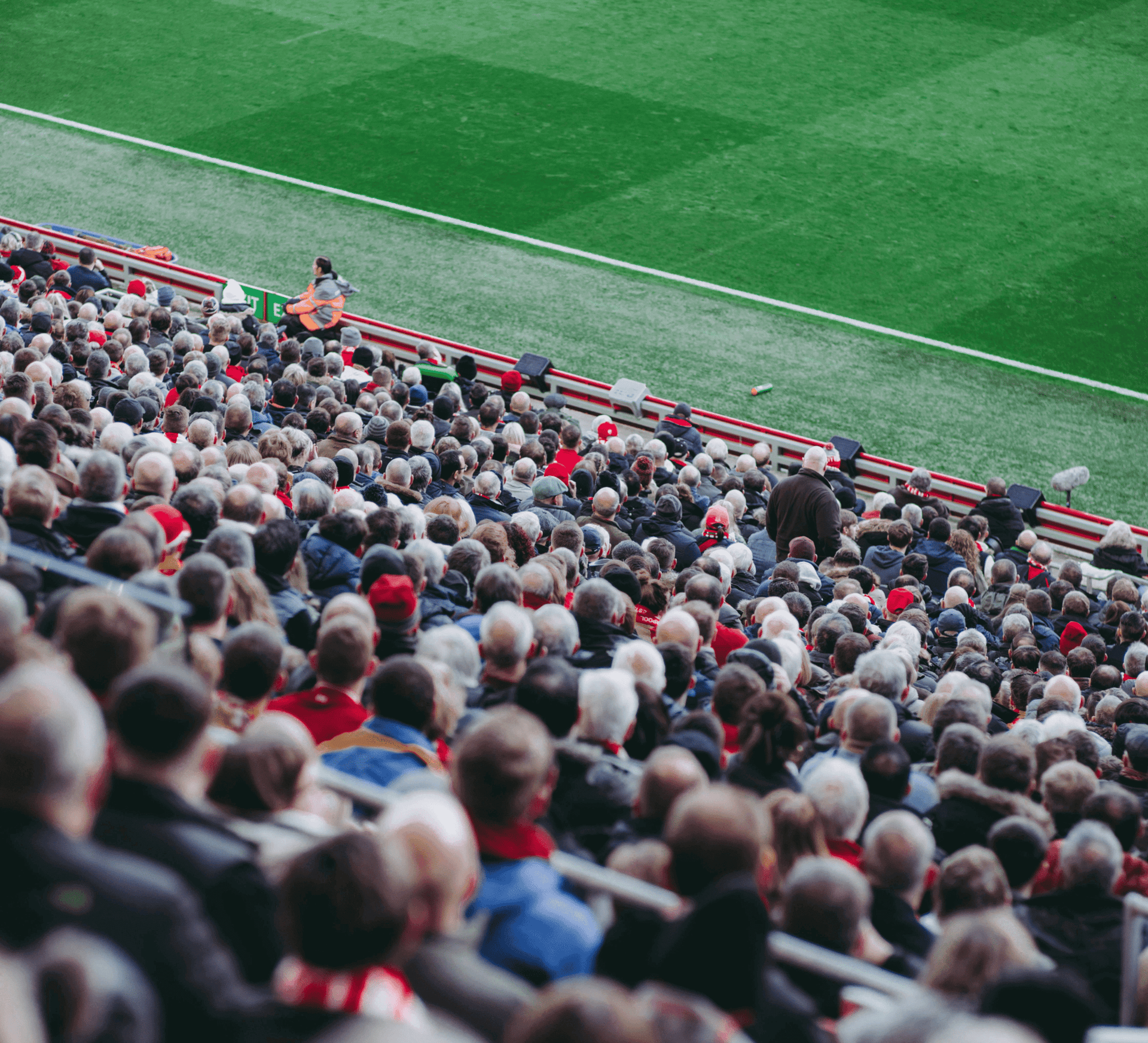 A packed stadium crowd looking towards the pitch, illustrating the scale of matchday movement