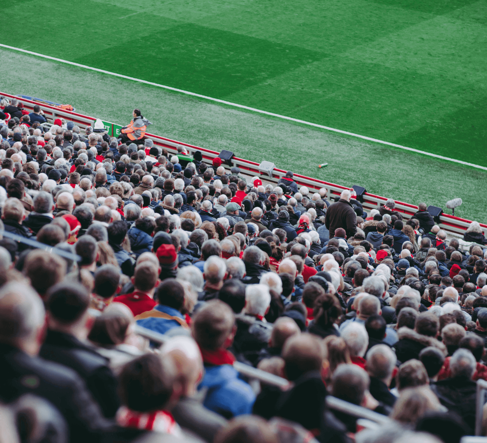 A packed stadium crowd looking towards the pitch, illustrating the scale of matchday movement