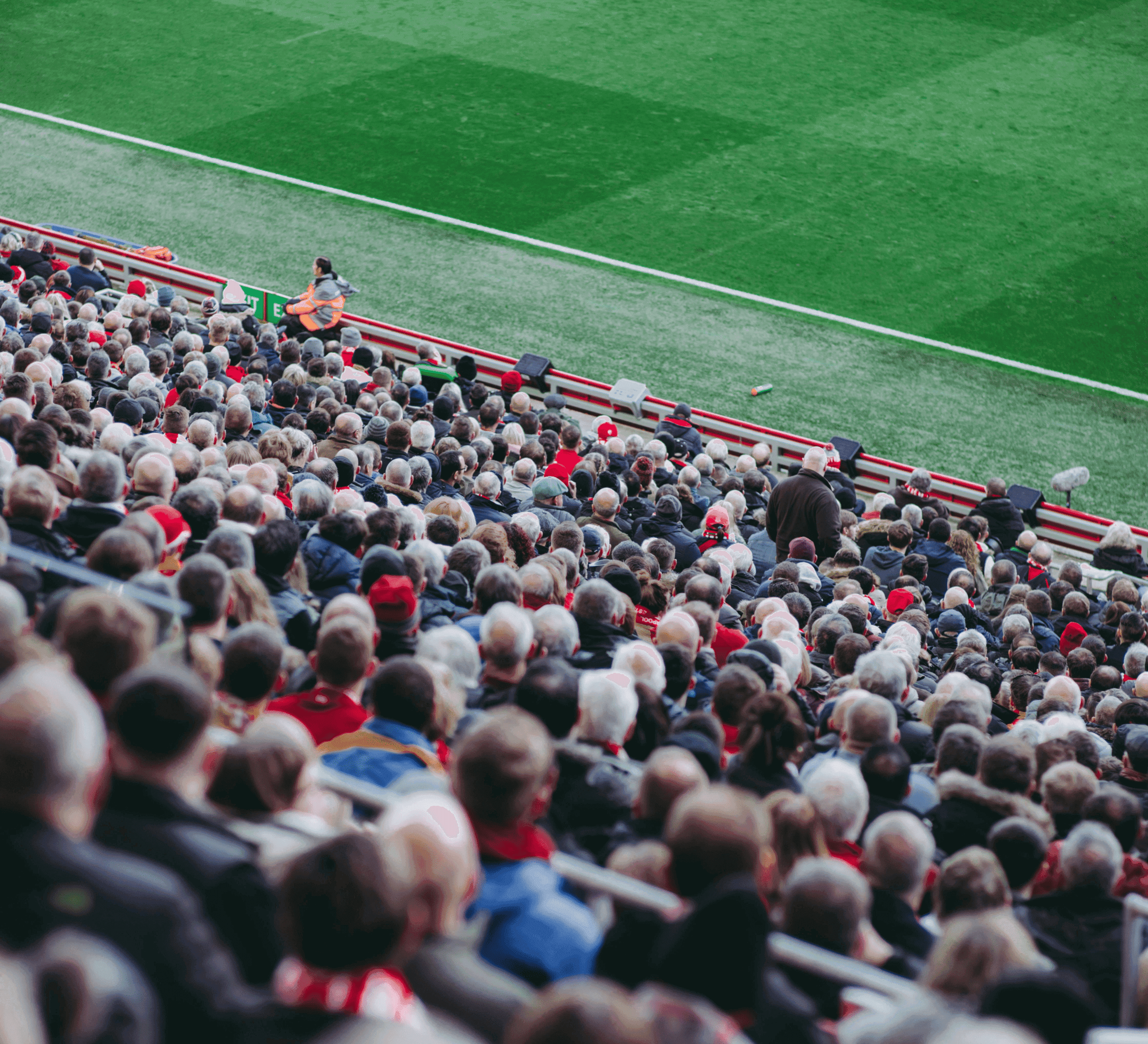 A packed stadium crowd looking towards the pitch, illustrating the scale of matchday movement